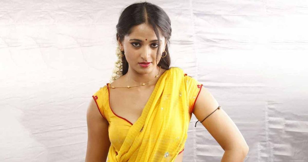 anushka shetty beautiful hot glamour in yellow saree navel